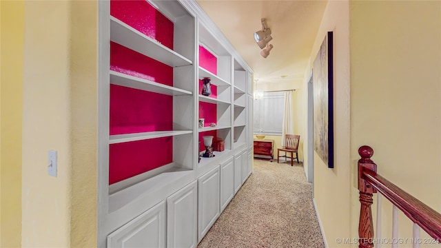 hallway with carpet floors