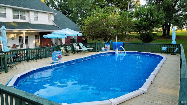 view of pool with a deck