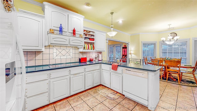 kitchen with pendant lighting, dishwasher, kitchen peninsula, sink, and white cabinetry