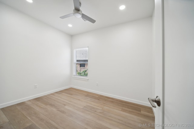 empty room featuring ceiling fan and light wood-type flooring