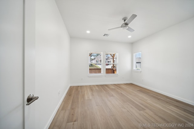 spare room with ceiling fan and light hardwood / wood-style flooring