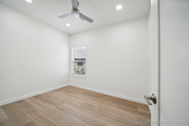 unfurnished room with ceiling fan and light wood-type flooring