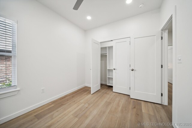 washroom with separate washer and dryer and light hardwood / wood-style floors