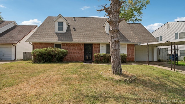 view of front of property featuring a garage, a front yard, and a carport