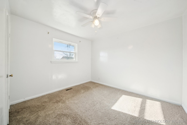 unfurnished room with carpet and ceiling fan