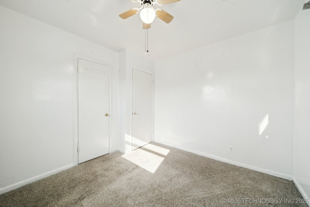 unfurnished bedroom featuring carpet floors and ceiling fan