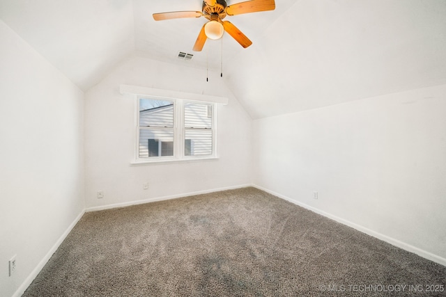 additional living space with carpet floors, vaulted ceiling, and ceiling fan