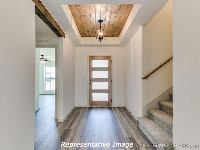 entrance foyer with a tray ceiling, ceiling fan, wooden ceiling, and light hardwood / wood-style flooring