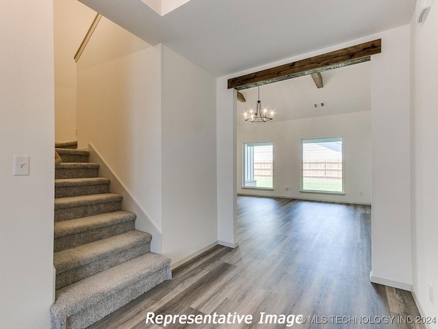 stairway with high vaulted ceiling, wood-type flooring, a chandelier, and beamed ceiling