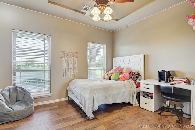 bedroom with hardwood / wood-style floors and ceiling fan