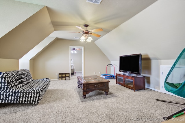 carpeted living room with ceiling fan and lofted ceiling