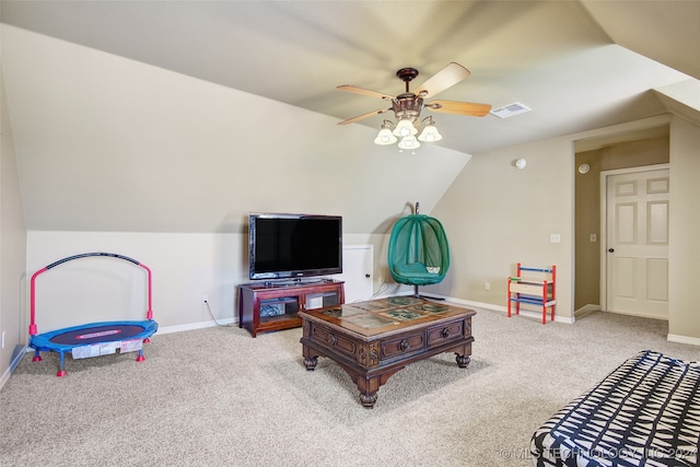 recreation room with ceiling fan, carpet floors, and vaulted ceiling