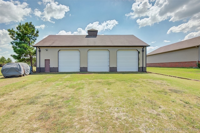 garage with a lawn