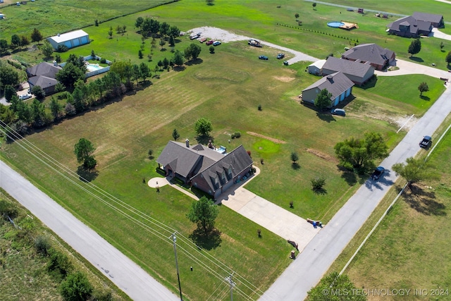 birds eye view of property featuring a rural view