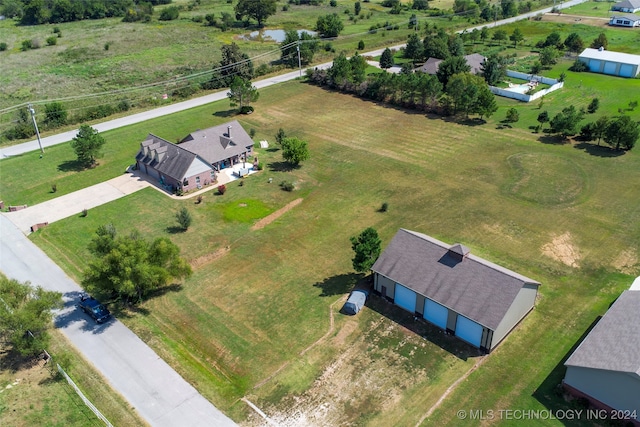 birds eye view of property featuring a rural view