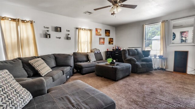 living room with ceiling fan and carpet flooring