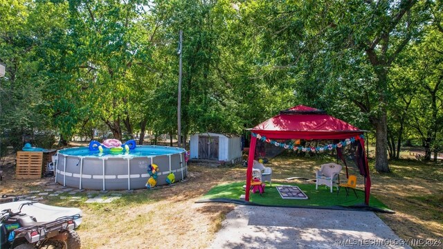 view of yard featuring a storage shed and a gazebo