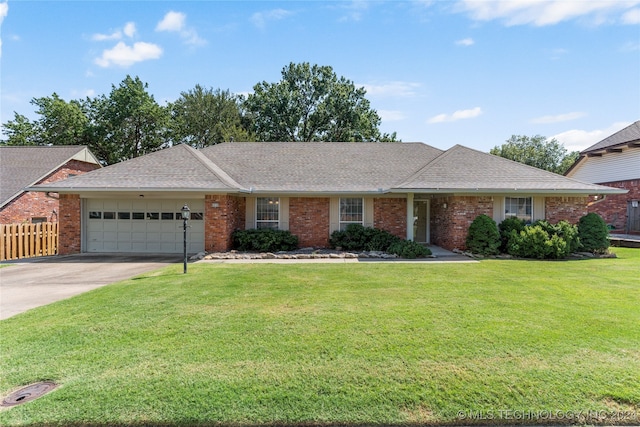 ranch-style house with a front lawn and a garage