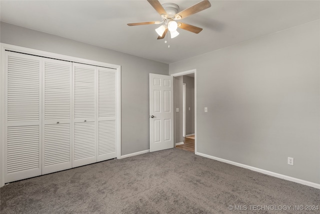 unfurnished bedroom featuring carpet flooring, ceiling fan, and a closet