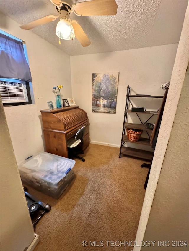 interior space featuring a textured ceiling, carpet, ceiling fan, and cooling unit