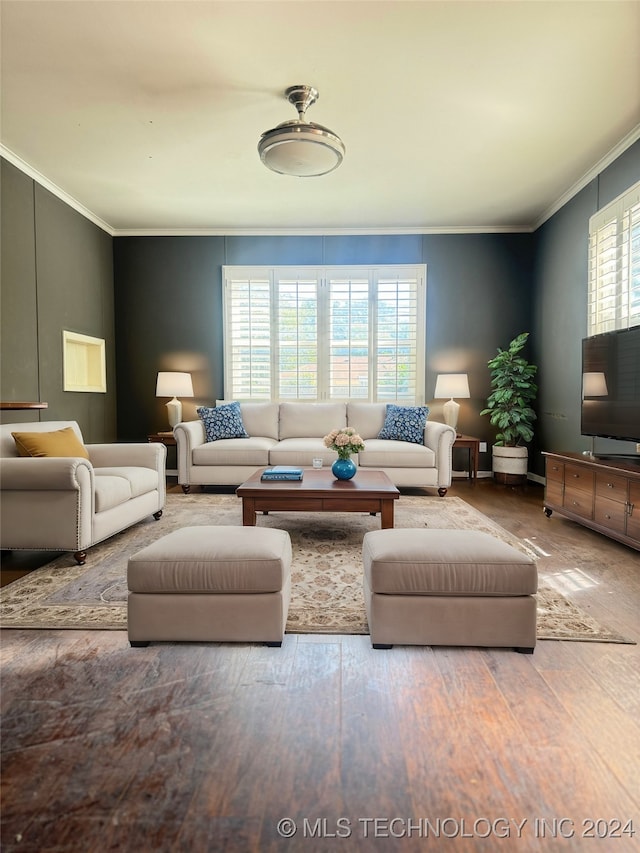 living room with ornamental molding and wood-type flooring