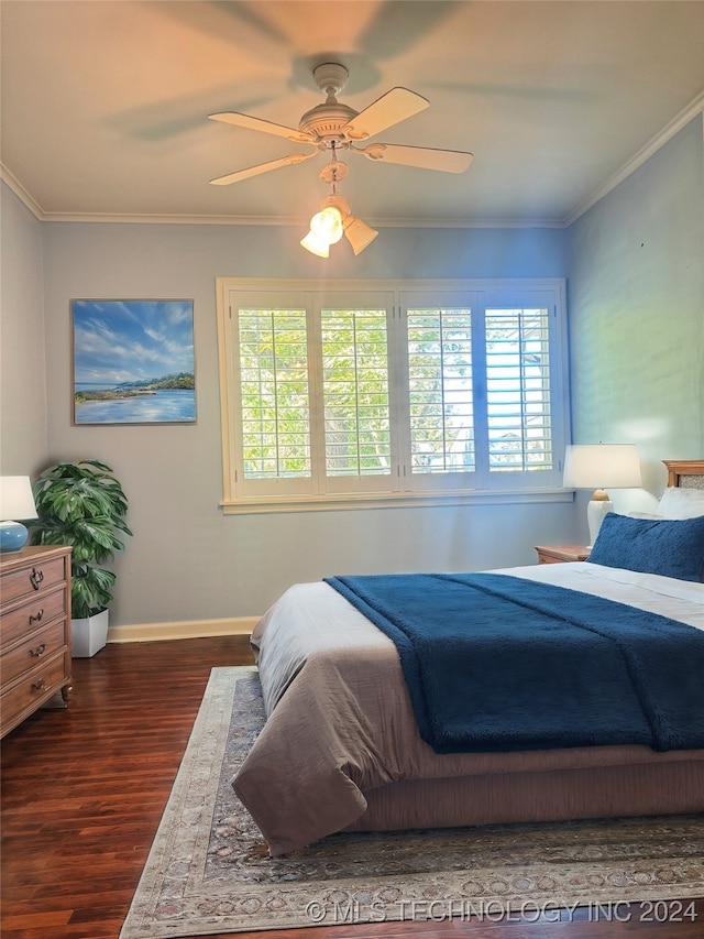 bedroom with ornamental molding, dark wood-type flooring, multiple windows, and ceiling fan