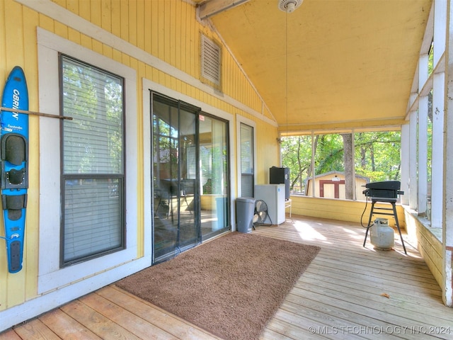 wooden deck featuring area for grilling