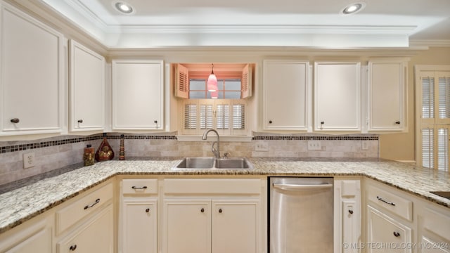 kitchen featuring crown molding, sink, pendant lighting, and light stone counters