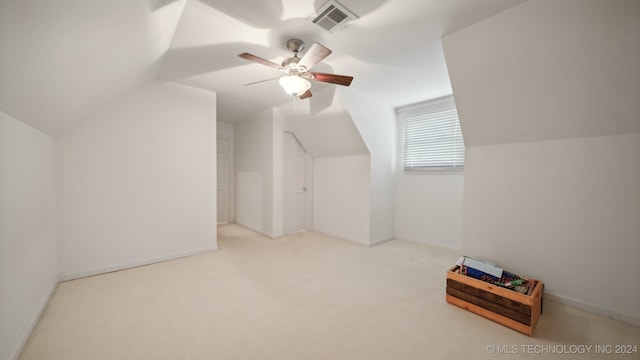 bonus room with ceiling fan, light carpet, and vaulted ceiling