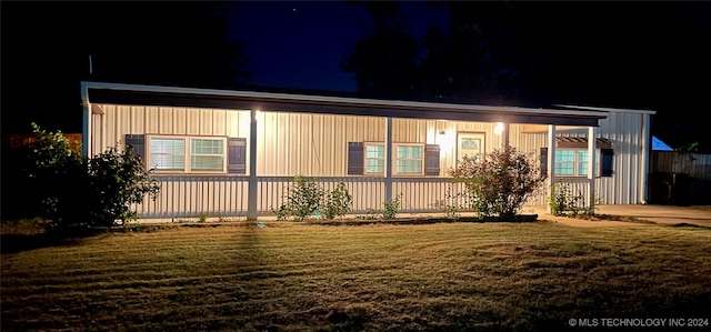 view of front of house with a yard