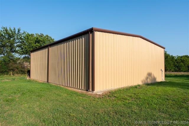 view of outbuilding with a yard