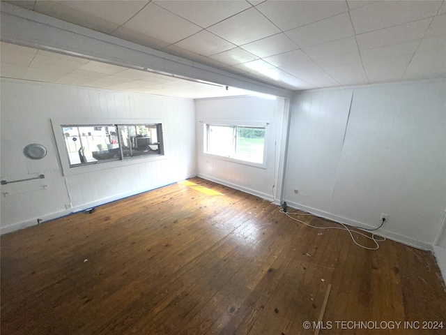 empty room featuring dark wood-type flooring