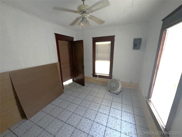 unfurnished room with a ceiling fan