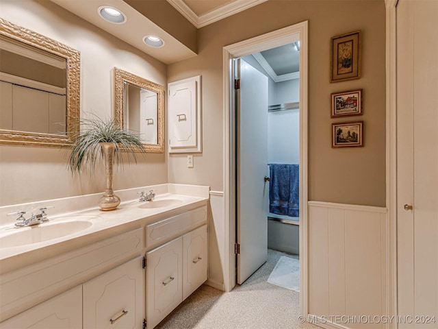 full bath with recessed lighting, double vanity, ornamental molding, and a sink