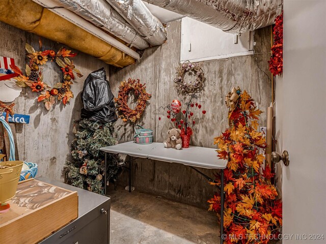 misc room featuring unfinished concrete floors