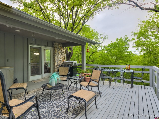 wooden deck featuring grilling area