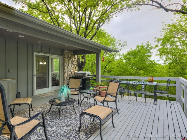 wooden deck with area for grilling