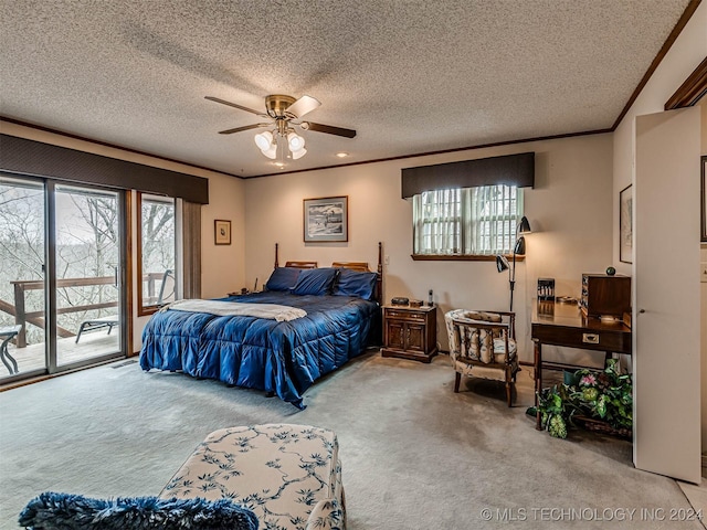 bedroom featuring a textured ceiling, carpet, access to exterior, and ornamental molding