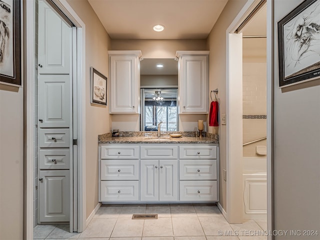 bathroom with tile patterned floors, ceiling fan, and vanity