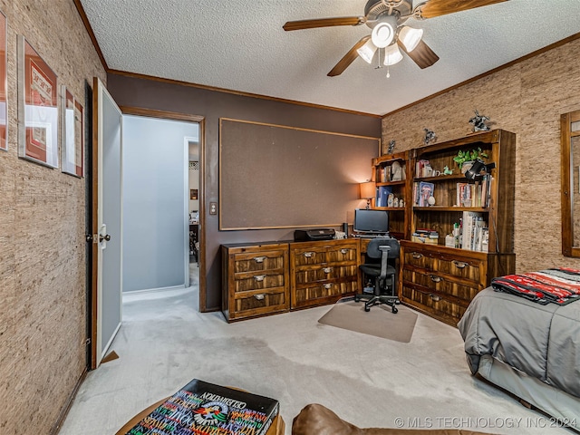 carpeted bedroom featuring ceiling fan, a textured ceiling, and ornamental molding