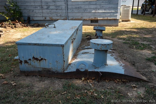 view of storm shelter with central AC unit