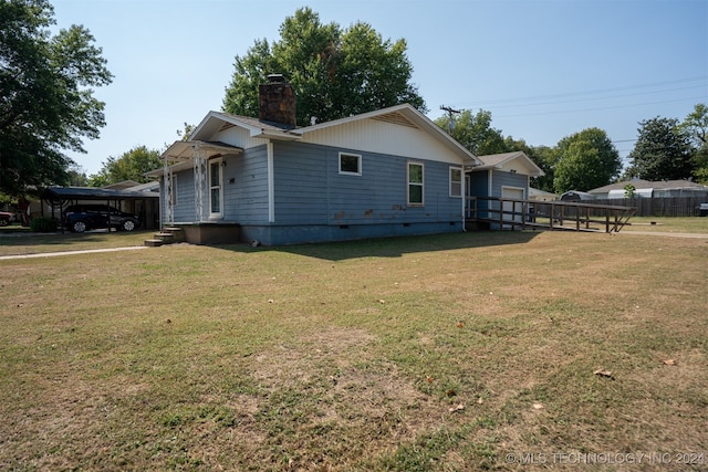 view of home's exterior with a yard