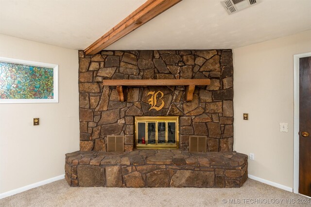 606 N B Ave, Cleveland, OK 74020 - detailed view of carpet flooring, baseboards, and a stone fireplace