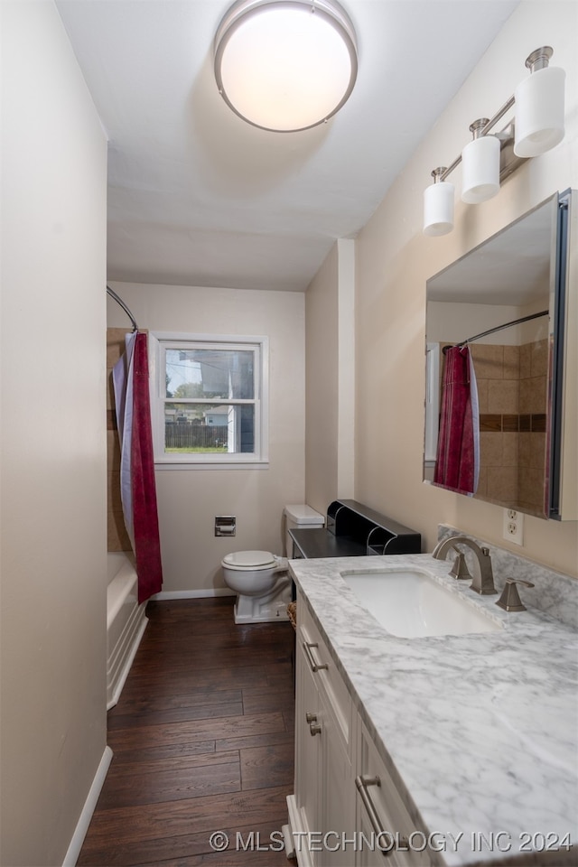 full bathroom with vanity, toilet, wood-type flooring, and shower / bath combination with curtain