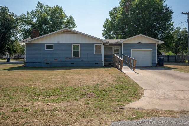 606 N B Ave, Cleveland, OK 74020 - ranch-style home with a garage, crawl space, a chimney, and concrete driveway