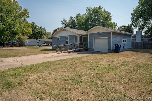 single story home featuring a front lawn