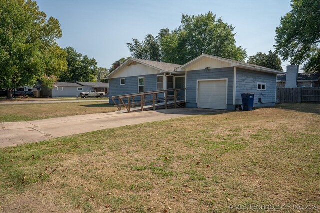 606 N B Ave, Cleveland, OK 74020 - single story home with driveway and an attached garage