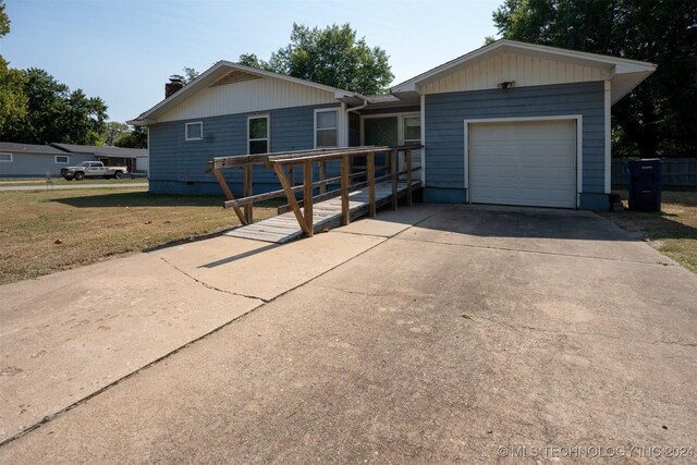 606 N B Ave, Cleveland, OK 74020 - ranch-style home featuring a garage, concrete driveway, and a chimney