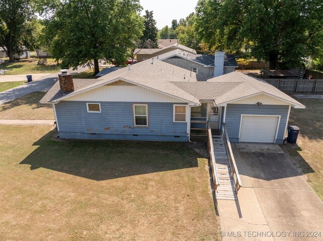 606 N B Ave, Cleveland, OK 74020 - view of front of property with a chimney, driveway, roof with shingles, a garage, and crawl space