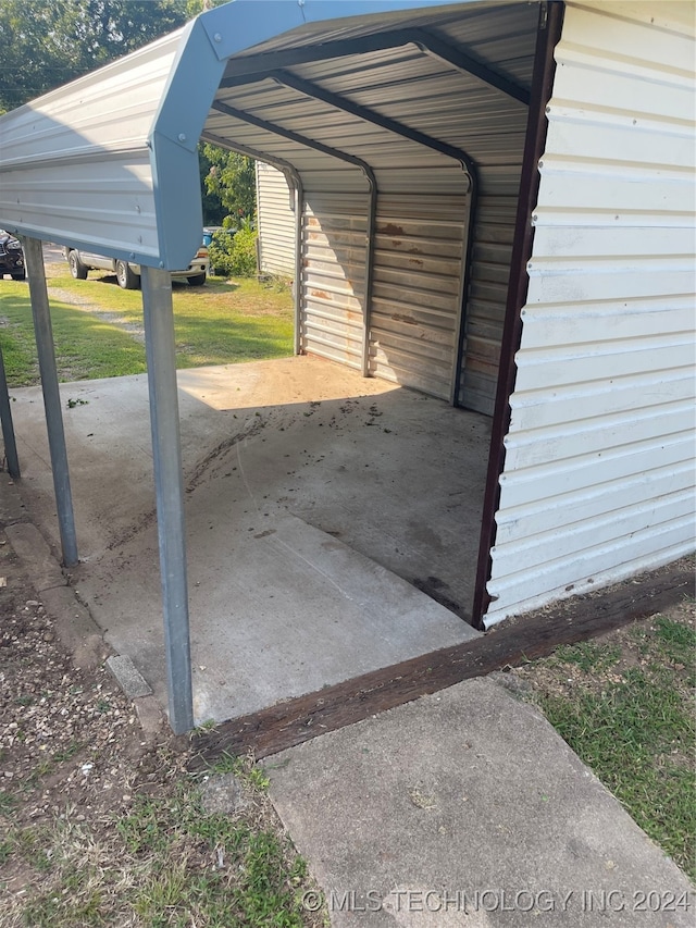 garage featuring a carport